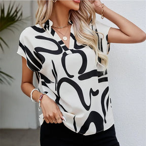 Blusa Casual Verão – Manga Morcego, Decote em V e Estampado Elegante